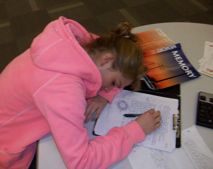 Teenager Sleeping While Studying
