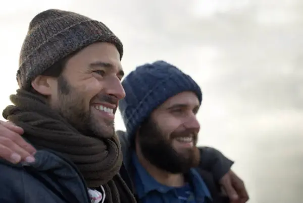 Two men smiling